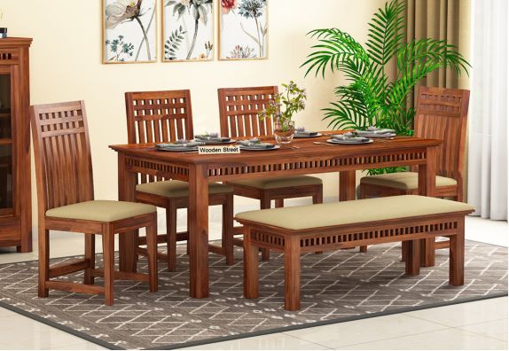 Get latest dining table designs online at woodenstreet