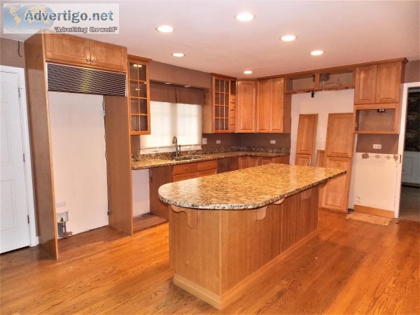 Maple Kitchen With Island And Granite Counter Tops