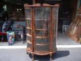 ANTIQUE OAK CURVED GLASS CURIO CABINET This is an antique oak cu