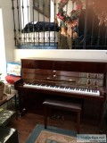 Upright piano glossy brown seldom used  in very good condition. 