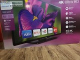 Philips 55 inch 4K smart T.V. with 100 dvd s and T.V. stand