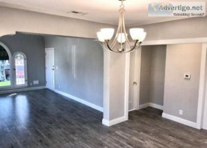 Spacious Kitchen with tall cabinetry and quartz countertops