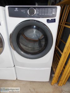 White Electrolux Gas Dryer And White LG Washer With Pedestals